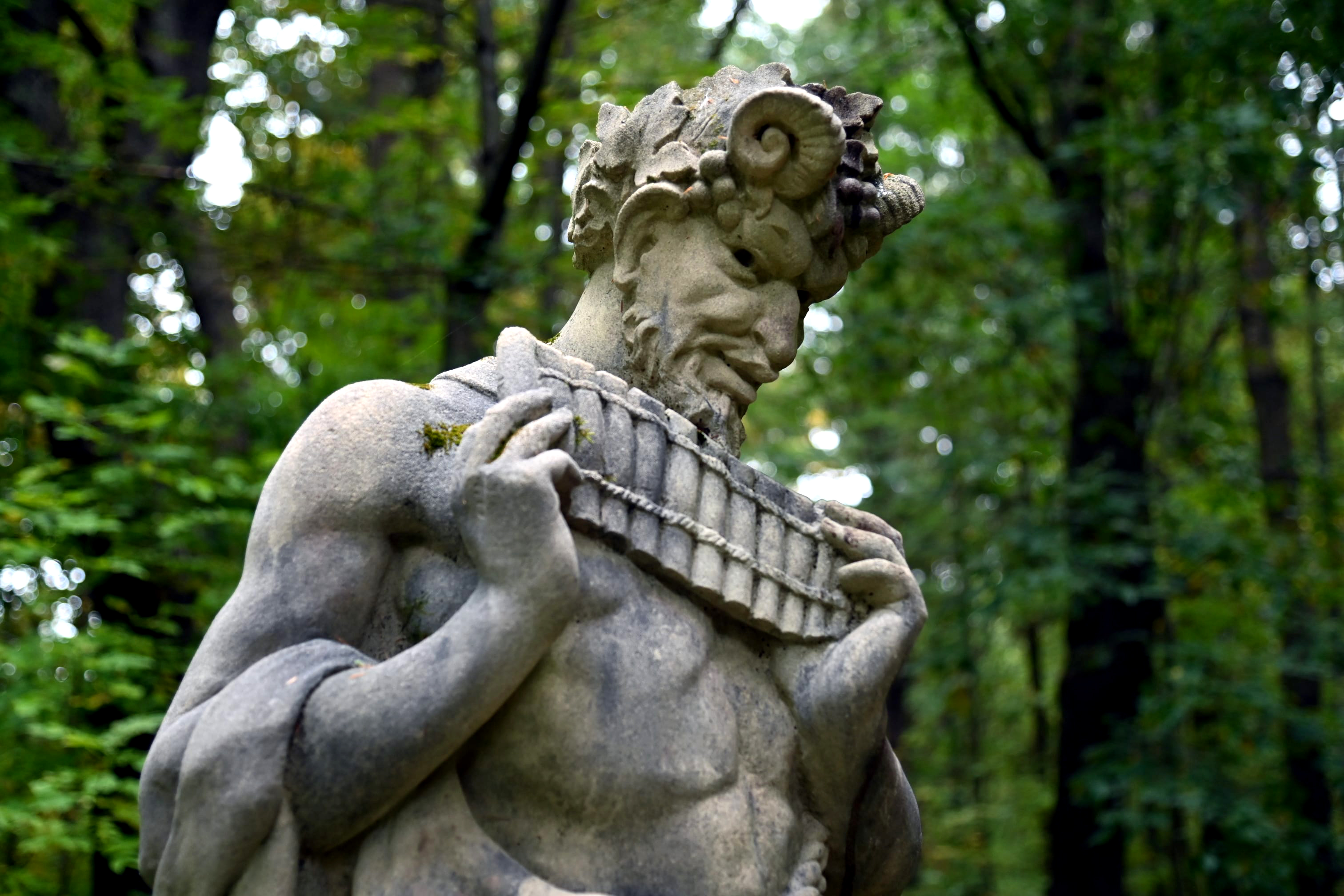 A statue of Pan playing his panflute at Tower Hill Botanical Gardens